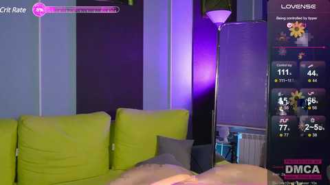 Media: Video of a cozy living room with a bright green couch, purple accent lighting, and a digital display showing health stats.