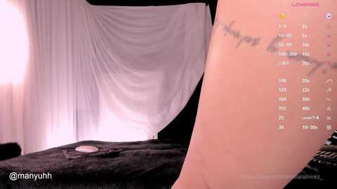 Media: Video of a woman with a tattooed arm and a white sheet draped over a bed, showcasing a calendar app on her phone.