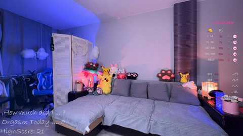 A video of a cozy, themed bedroom featuring a Pikachu-themed bedspread, Pikachu and Eevee plushies, a Pok\u00e9mon-themed poster, and a soft, warm ambiance with dim lighting and blue accents.