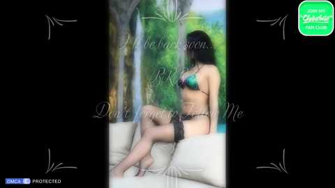 Media: A video of a slender, dark-haired woman in black lingerie and thigh-high stockings, sitting on a white couch, with a green \"PORN\" watermark overlay.