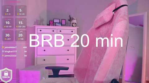 Media: Video of a cozy, pastel-pink-themed room with a plush, furry chair and white dresser, displaying a pink teddy bear and framed photos. Text overlays \"BRR 20 min\" and \"ONCA 1\" with various icons.