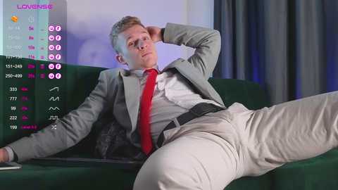 Media: Video of a bored, red tie-wearing man on a green couch, with a social media screen showing Likes and comments.