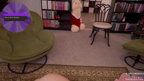 A video of a cozy living room with a plush, light beige chair, green armchair, and bookshelf filled with colorful books. A stuffed animal sits on the floor in the background.