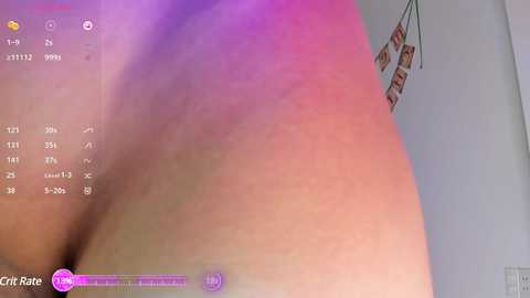 Video of a close-up of a person's buttocks, captured from a low angle, with a soft pinkish-purple lighting effect. The background shows a white wall with a small, red and white sign hanging.