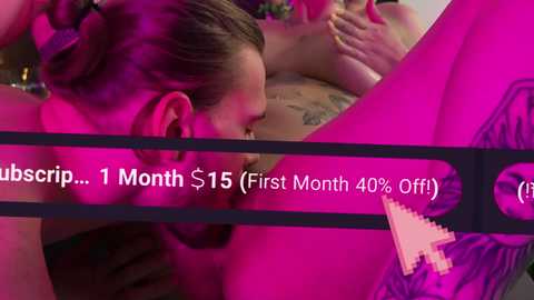 Media: A close-up video featuring a woman with brown hair in a bun, engaged in a sexual act with a tattooed person. The background is pink and the scene is blurred. Text on the image reads \"1 Month $15 (First Month 40% Off).\