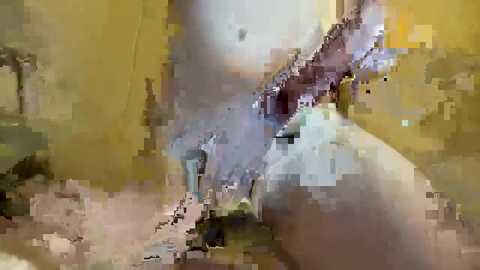 Media: This image appears to be a digital video featuring a blurred, abstract scene with muted colors of yellow, brown, and beige. It depicts a narrow, dark alleyway with indistinct figures walking, possibly in a city setting.