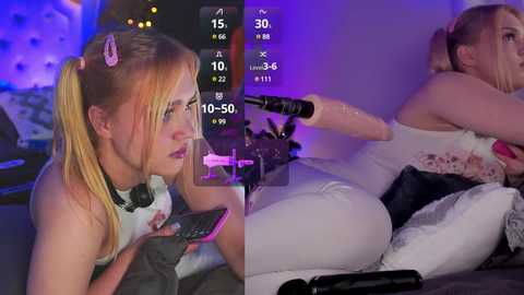 Media: A split-screen video shows a blonde woman in a white dress with pink hair ties, playing a video game on a tablet, and a nude blonde woman lying on a bed, being spanked with a paddle.