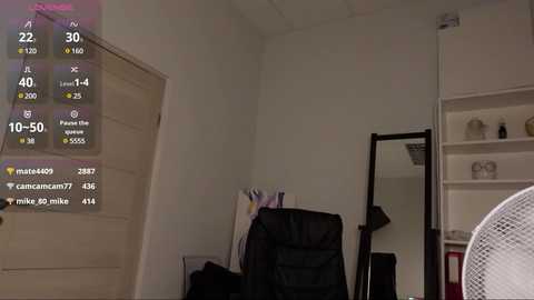 Media: Video of a minimalist, dimly lit bedroom with white walls, a closed door, a black office chair, and a standing mirror, displaying a live YouTube video feed with a user count of 10,500.