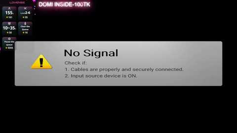 Media: A digital screenshot of a computer screen displaying a warning message \"No Signal\" with a yellow triangle exclamation mark. The background is black, and the interface is minimalistic with a few options and settings visible.