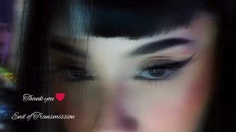 Media: A close-up video of a woman with dark hair and heavy, winged eyeliner, blurred background, \"Thank you End Of Fashionation\" text in white, pink heart, and \"End of Fashionation\" logo.