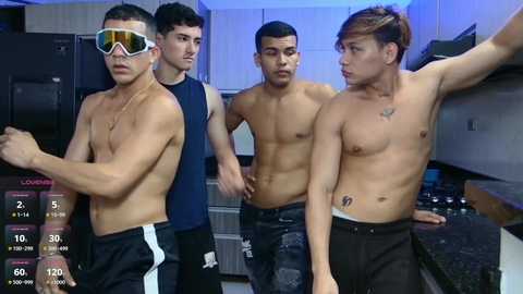 Media: Video: Four shirtless, fit men, two with tattoos, in a kitchen, looking concerned. One wears reflective sunglasses. Modern appliances, white cabinets, and a digital clock display.