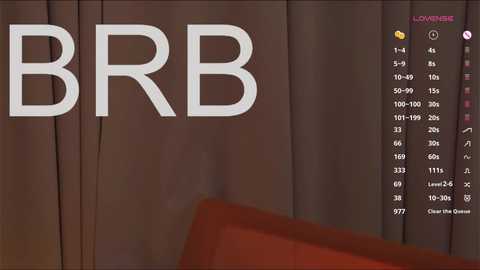 A video showing a close-up of a brown curtain with white text reading \"BRB\" on the left side. The right side displays a numeric keypad with a \"1\" highlighted.