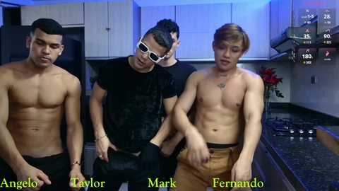 Media: Video of three shirtless Asian men in a modern kitchen, displaying various body types and tattoos. The background features white cabinets, a stove, and a red flower arrangement.