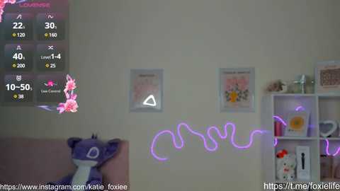 Media: Video of a cozy room with a furry plush toy, a wall calendar, and a glowing neon \"Cute\" sign, displaying a temperature gauge and social media links.