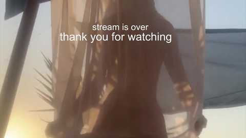 Media: Video of a nude woman with long, flowing hair, standing in a sunlit room with beige walls. Text overlay reads, \"stream is over thank you for watching.\