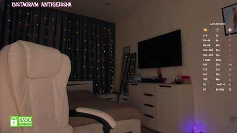 Media: Video of a dimly lit bedroom with a white office chair, a flat-screen TV, a dresser, and a bed with dark curtains. \"Instagram/ANTIGENESSA\" watermark in the top left corner.