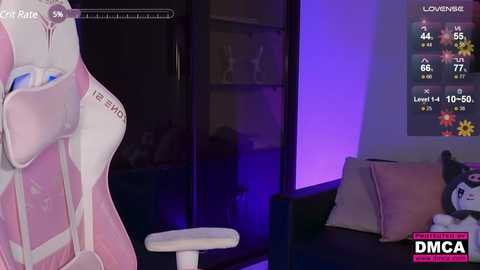 Media: A video of a cozy room with a purple glow, featuring a white gaming chair, a TV displaying \"Lomense,\" and a plush toy on a black couch.