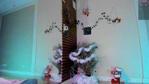 Media: Video of a cozy living room corner with a brick wall, Christmas wreaths, and a wooden ladder. A red stocking hangs from the ceiling, creating a festive, warm atmosphere.