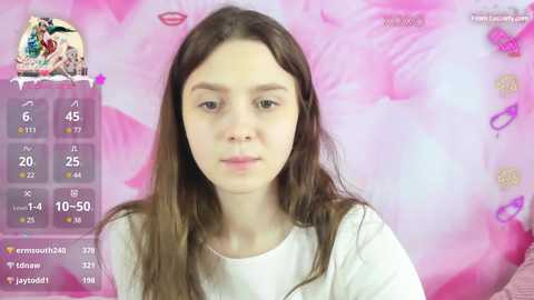 Media: Video of a young girl with long brown hair, wearing a white shirt, against a pink floral background. Social media icons and a \"Follow\" button are visible in the top left corner.