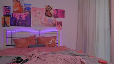 Media: Video of a messy bedroom with a pink and purple color scheme. A white bed with orange pillows and a pink blanket. The wall is adorned with colorful anime posters.