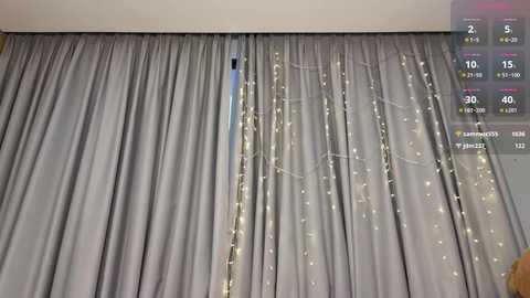 Media: A video of a bedroom with gray curtains and fairy lights, showing a digital clock displaying 2:15 and a weather forecast.