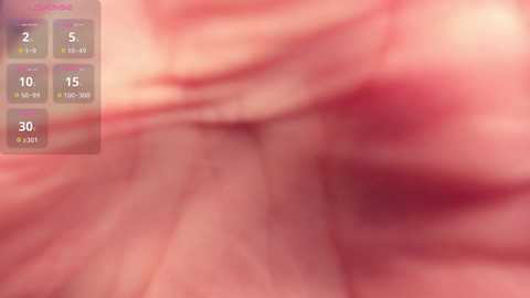 Media: Blurred close-up video of human intestinal tissue, showcasing pinkish-red mucosa with visible folds and textures. The image includes a digital overlay with various health statistics and measurements in the upper left corner.