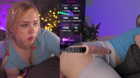 Media: Video of a blonde woman in a blue sweater, holding a large dildo, with a fitness app screen displaying exercise stats in the background.