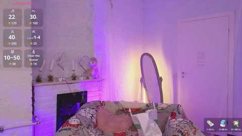 Media: A video of a cozy, dimly lit room with a white brick fireplace, a silver floor lamp, a decorative white ceramic cat, and a cluttered couch covered in a patterned blanket.