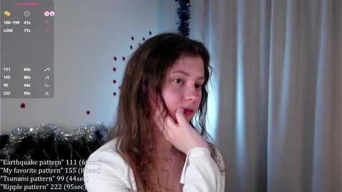 Media: A video shows a young girl with long brown hair, wearing a white shirt, looking thoughtful, with a digital interface in the background displaying \"Earthquake pattern\" details.