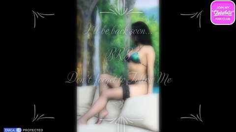 Media: A blurred, erotic video of a woman in a green bikini, sitting on a beige couch, with a background of green foliage and a pool. Text overlays the image, reading, \"I'm back again... Don't forget to follow me.\