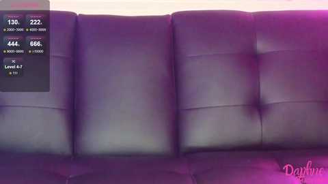 Media: Video of a sleek, modern black leather couch with tufted backrest, illuminated with purple and pink lighting. A digital sleep tracker display shows 1500 hours, 46 minutes, 66 seconds, Level 6, and 5:00 AM.