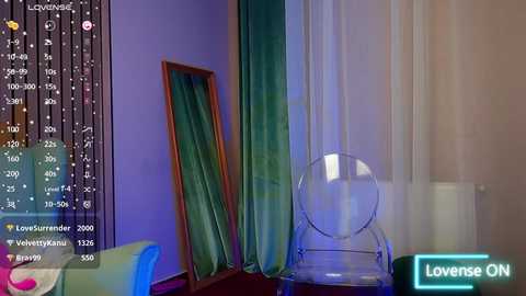 Media: A video shows a minimalist bedroom with a large green velvet curtain, a wooden mirror, and a transparent chair, set against a purple and white background.