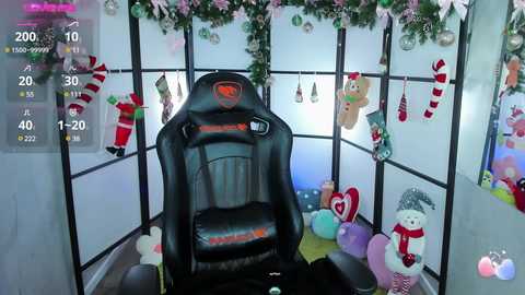 Media: Video of a cozy, festive room with a black gaming chair, decorated with Christmas ornaments and plush toys, featuring a snowman and Santa Claus, set against white walls with green accents.