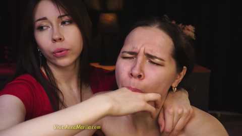 Media: A video of two women, one with long black hair in a red top, and the other with brown hair in a red top, engaged in oral sex.