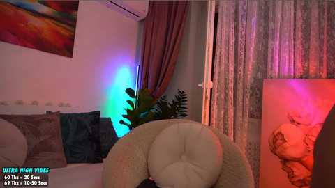 Media: Video of a plush bear on a bed, with colorful lights and a painting in the background, featuring a \"Ultra High Vibe\" caption.