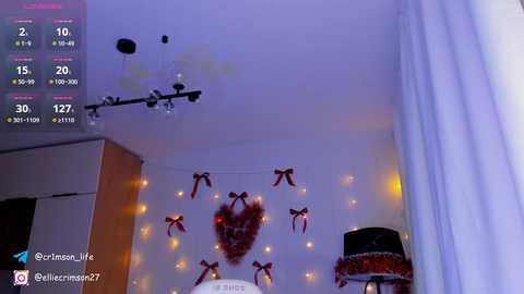 Media: Video of a cozy, dimly lit room with a ceiling fan, fairy lights, and a festive Christmas tree.