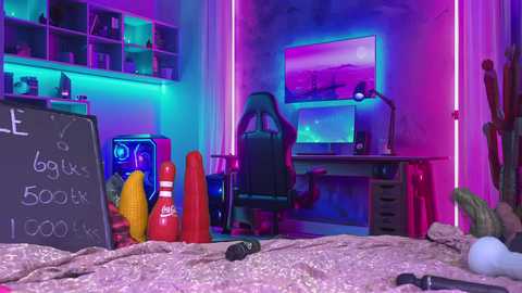 Video of a neon-lit, gamer-themed bedroom with a blackboard, toy bananas, and a plush toy in the foreground. Background features a desk, monitor, and gaming chair under purple and blue lights.