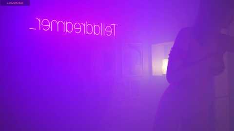 Media: Video of a dimly lit corridor with a purple haze, featuring the word \"memorable\" in light pink letters on the left wall. The background is blurred, suggesting a serene, almost ethereal atmosphere.