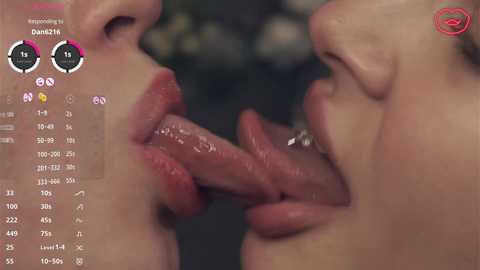 Video of two women with light skin, their tongues licking each other's genitals. Background shows an interface with stats and a red logo.