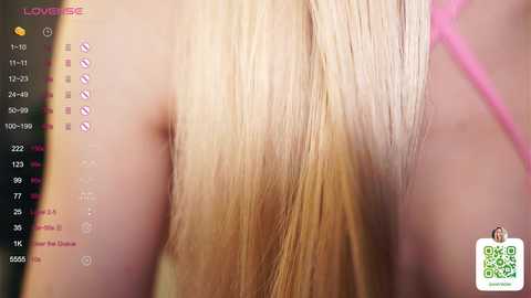 A close-up video of a woman's straight, platinum blonde hair, with a digital interface displaying hair color options on the left. The background is blurred, focusing on the hair's sleek texture and highlights.