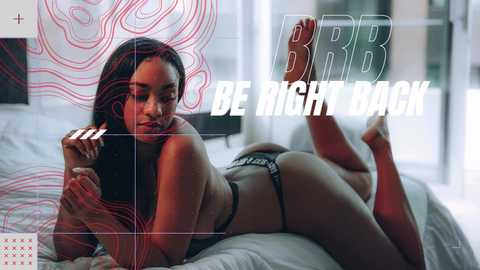 Video of a black woman with long braids lying seductively on a bed, wearing black lingerie. Background features abstract red and white designs. Text overlay reads \"BE RIGHT BACK\" in bold white letters.