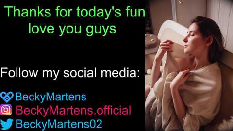 Media: Video of a woman with light skin and dark hair, wrapped in a beige blanket, holding a cup, with text thanking followers for support.