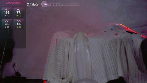 Media: Video of a dark, dimly-lit room with a bed covered in white, textured blankets. The bed appears unmade, with red and purple lighting creating an eerie ambiance. A game screen with stats, including a \"CriRate\" of 70%, is visible in the top left corner.