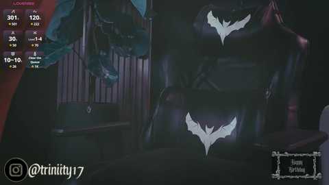 Media: A dark, CGI-rendered image shows a Batman costume with white bat symbol, set against a dimly lit room with a wooden chair and red curtains.