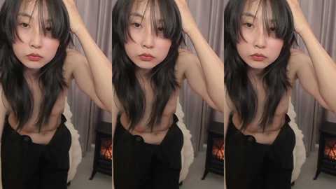 Media: A side-by-side photo series of a young Asian woman with long black hair, bare-chested, wearing black pants, posing provocatively in front of a fireplace.