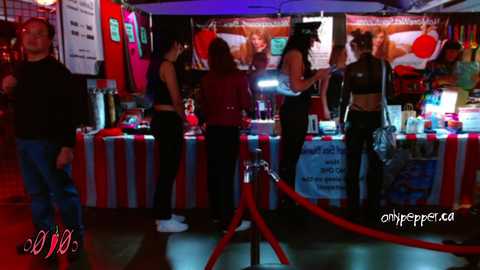 Media: Video of a dimly-lit arcade with red and blue lighting, featuring a variety of video games and pinball machines.