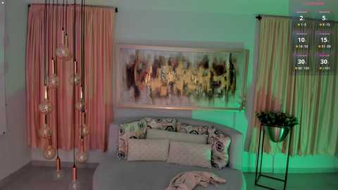 Media: A video of a modern bedroom with beige walls, pastel curtains, a large abstract painting, decorative pendant lights, and a bed with patterned pillows.