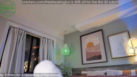 Media: Video of a modern bedroom with a bed, green pendant lights, a framed abstract art piece, and a window with sheer curtains. Text overlay advertises OnlyFans content.