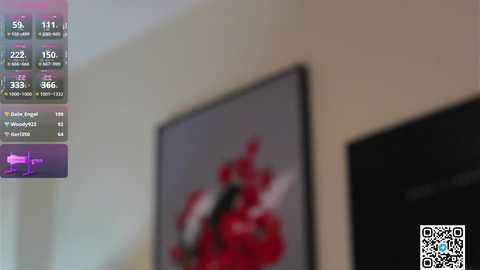 Media: A video of a dimly-lit room showing a framed red and white abstract painting on a beige wall. In the background, a digital screen displays stock market data, with a QR code at the bottom right.