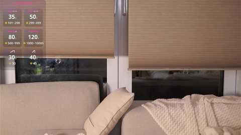 Media: Video of a beige sofa with a textured blanket, a closed beige roller blind, and a smart screen displaying weather information, in a modern, minimalist living room.